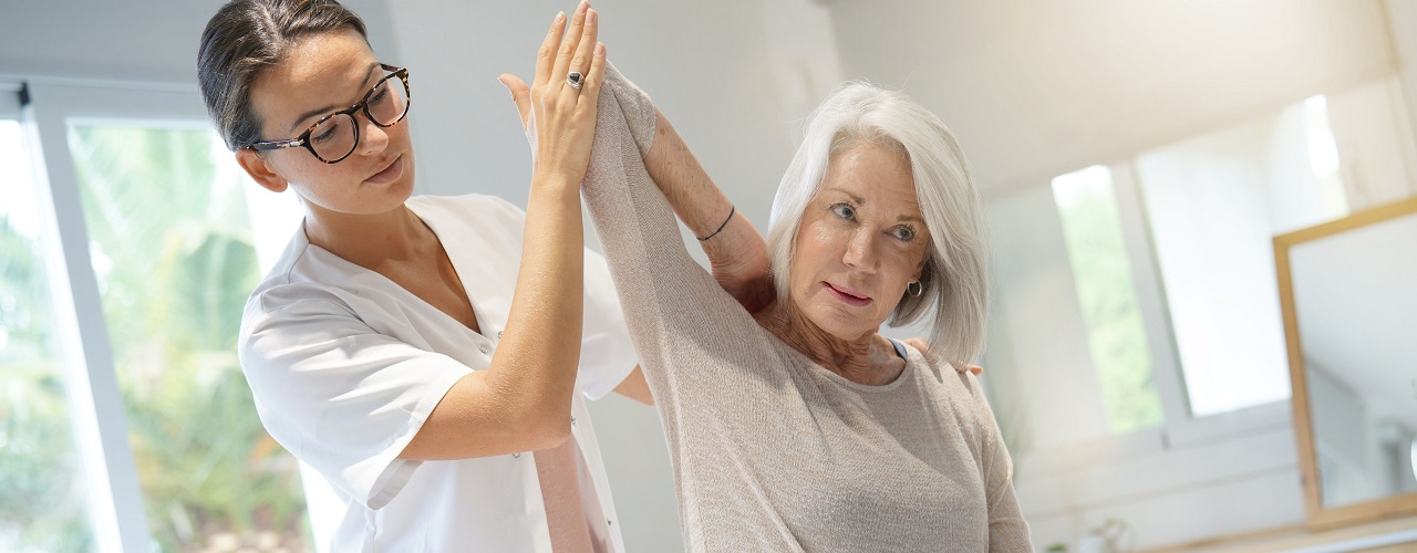 Senior woman with her physiotherapist